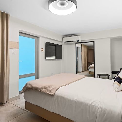 A minimalist bedroom with clean lines perfect for a serene and peaceful atmosphere.