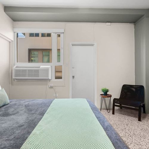 Experience peaceful nights in this bright and airy bedroom, where every detail contributes to a serene environment for your restful sleep.