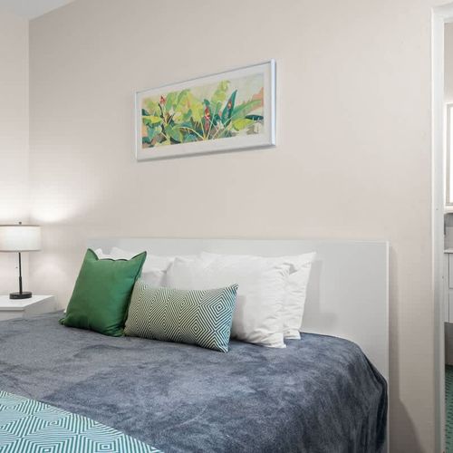 Experience peaceful nights in this bright and airy bedroom, where every detail contributes to a serene environment for your restful sleep.