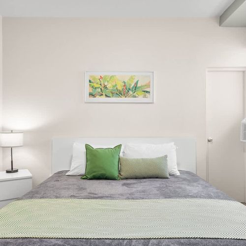 Experience peaceful nights in this bright and airy bedroom, where every detail contributes to a serene environment for your restful sleep.