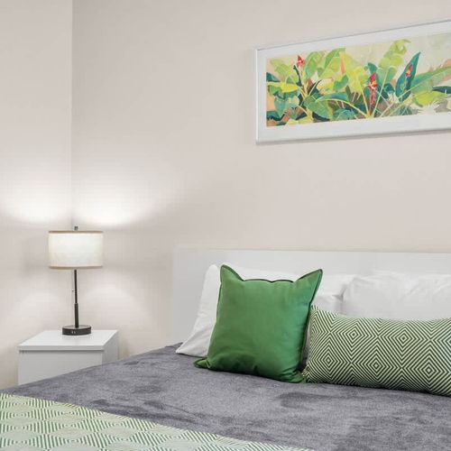 Unwind in a serene setting! This comfortable bedroom is thoughtfully decorated to provide a calming ambiance, ensuring a peaceful and enjoyable stay.