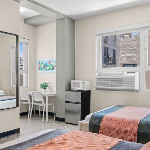 Experience a versatile living space flooded with natural light, featuring comfortable sleeping arrangements and ample room to relax and make yourself at home.