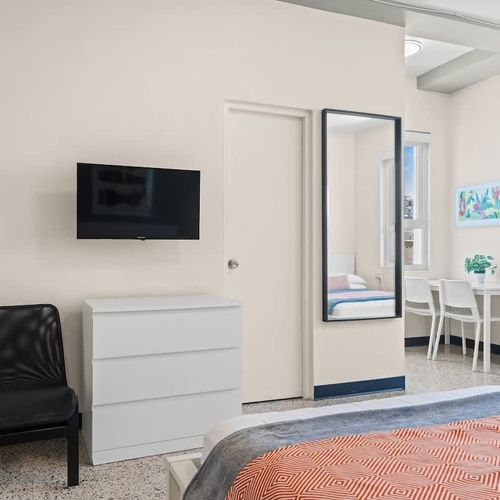 Drift into a state of calm in this serenely decorated bedroom with plush linens.