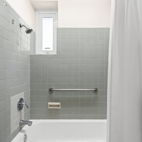 Enjoy a quick, invigorating shower in our sleek and renovated bathroom.