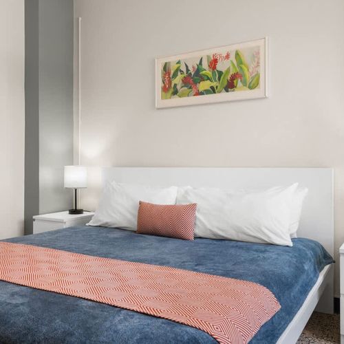 Discover a warm and welcoming atmosphere in this charming bedroom, perfect for unwinding and feeling right at home during your visit.