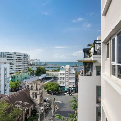 Enjoy the vibrant city life from your private balcony, offering a refreshing view of the surrounding architecture and a glimpse into the local ambiance.