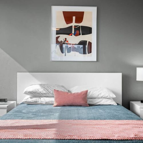 Step into a peaceful retreat designed for your ultimate relaxation. This comfortable bedroom provides a tranquil space for a restful night's sleep.