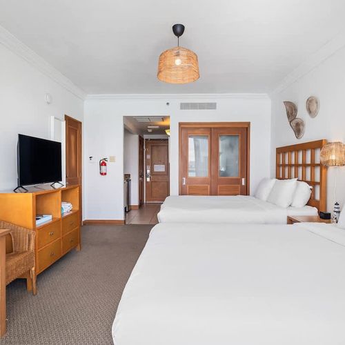 Perfect for friends or family, this bedroom features two cozy beds for a restful stay.