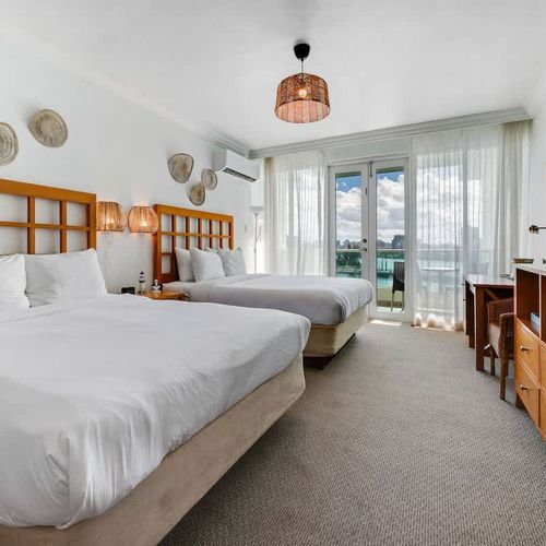 Whether you're traveling with a friend or family, this bedroom with two beds offers plenty of space and comfort.