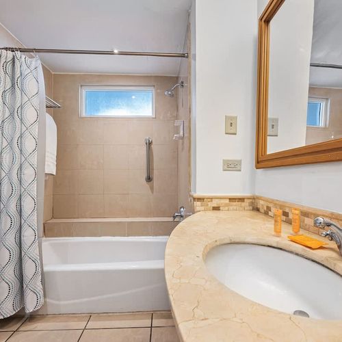 Unwind in luxury with a relaxing soak in this elegant bathtub, your personal spa retreat.