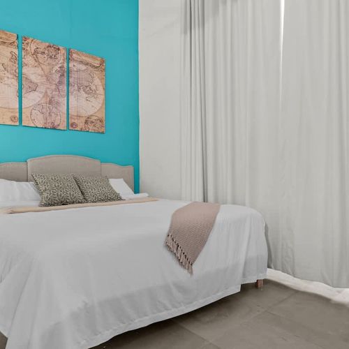 The comfortable bed and ample storage make this space both stylish and practical, offering a perfect retreat for relaxation.