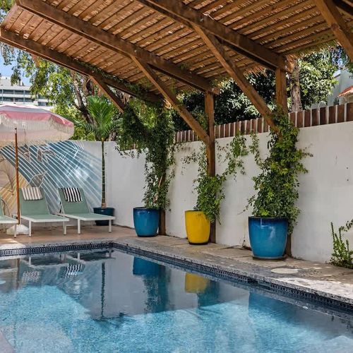 Take a refreshing dip in our pool under the clear sky.