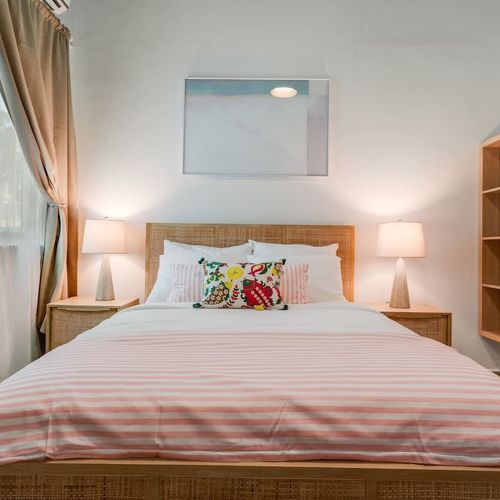 A peaceful sleeping area with one bed, designed for comfort.