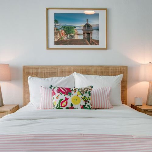 A clean design with a large bed, tall ceilings, and stylish touches.