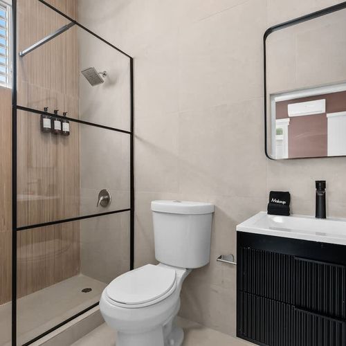 Enjoy a refreshing shower in this sleek, stylish bathroom.