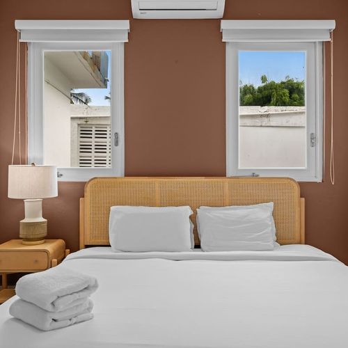 Relax in a spacious bedroom with a comfortable queen bed.