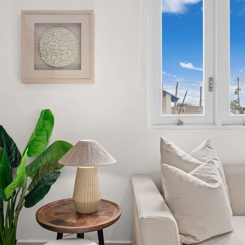 Unwind in this serene space with natural light.