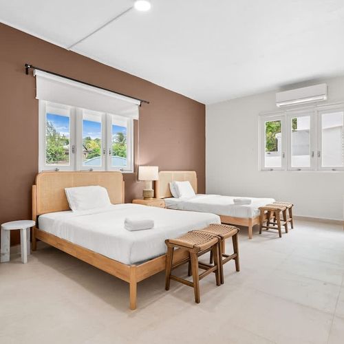 Bright, modern room with two comfy beds for a great night's sleep.