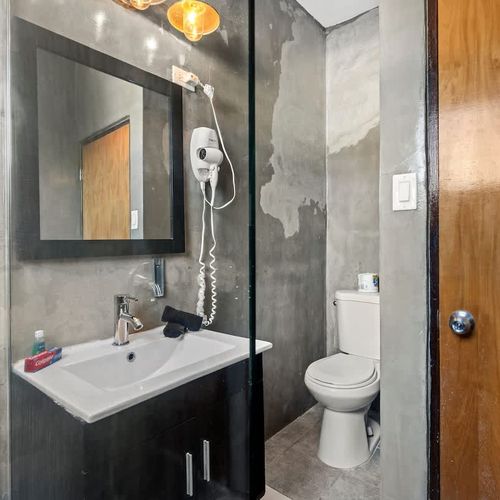 Spacious bathroom with all necessary amenities.