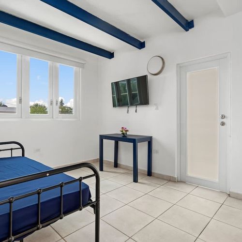 Comfortable bed and a TV for your entertainment.