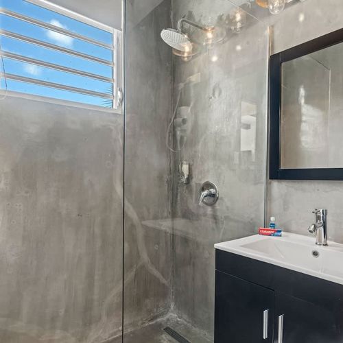 Modern shower and sink for a refreshing start.