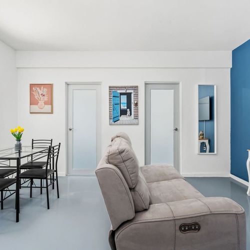 Bask in the natural light from the white doors and enjoy the curated comfort that awaits in this stylish space.