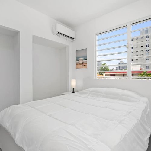 Soak in the natural light streaming through expansive windows, offering a view of the tranquil outdoors and ensuring a restful stay.