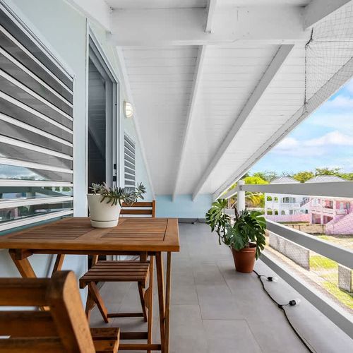 Step outside to your private balcony with seating for two – a peaceful spot to enjoy breakfast, evening drinks, or take in the local vibe.