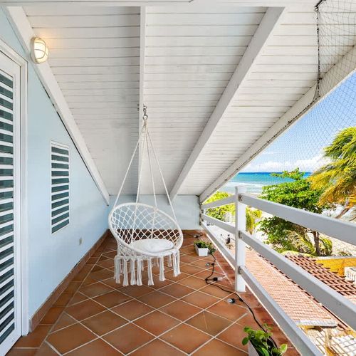 beachfront balcony with hammock