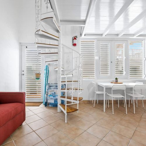 Enjoy meals in a bright dining area with open layout to a fully-equipped kitchen – perfect for group stays.