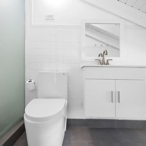 Sparkling Clean Bathroom with Remarkable Vanity. Step into a refreshing oasis with this pristine white bathroom.