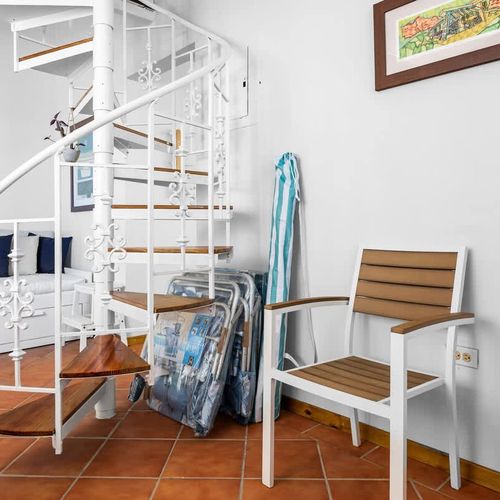 Charming spiral staircase. A fun architectural feature connecting your tropical home base.