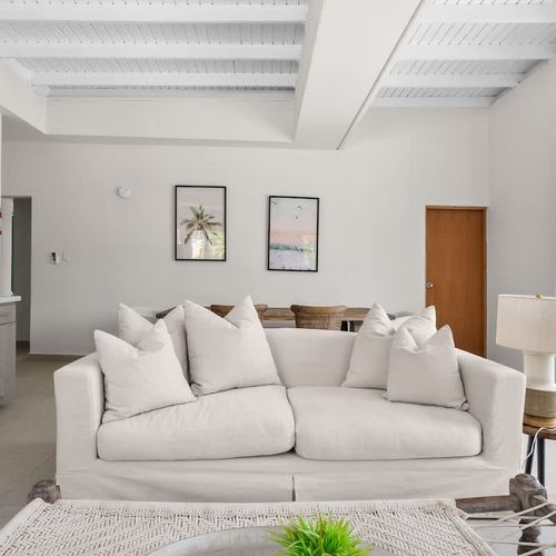 Relax in comfort. Plush sofa and modern decor for a cozy stay.