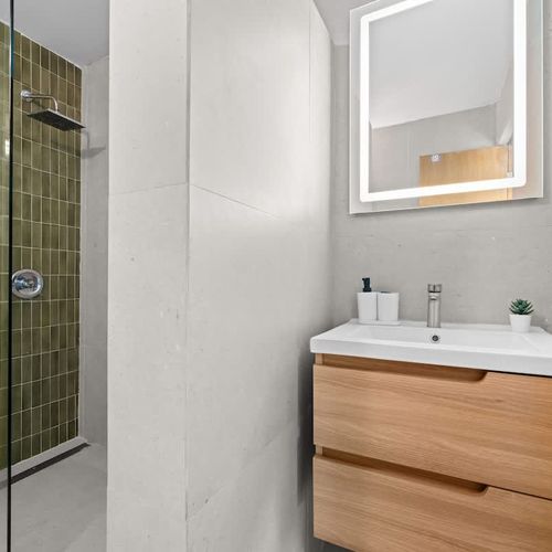 Unwind and recharge. A clean and spacious bathroom for your comfort.