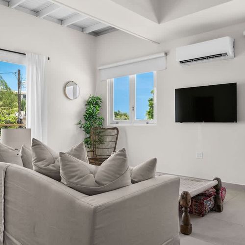 Bright and airy living space, perfect for movie nights or lounging.