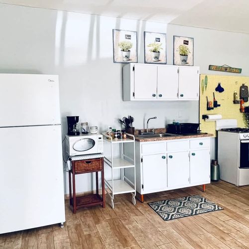 Whip up your favorite meals in our bright and fully equipped mini-kitchen, featuring a refrigerator, microwave, and stove for your culinary convenience