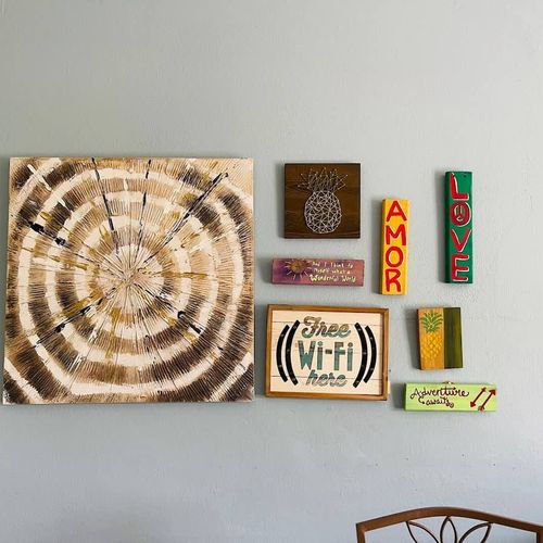 Connect and relax! Our beautifully curated space features unique local artwork and a clear Wi-Fi reminder, ensuring you stay connected while enjoying the charming decor.