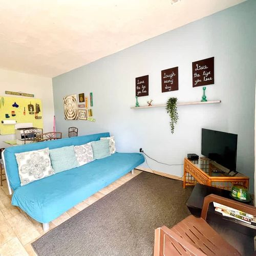 Relax in style! Our versatile living area features a comfortable sofa that easily converts into an additional bed, perfect for extra guests or cozy nights in."