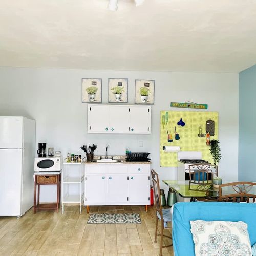 Enjoy the freedom of home-cooked meals! Our compact yet complete kitchen provides all the essentials, from a full-size fridge to a stove, making dining in a breeze."