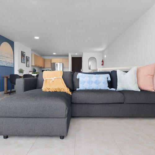 Cozy up in our inviting living area, designed for comfort and relaxation. The spacious sofa is perfect for movie nights or simply unwinding with a good book.