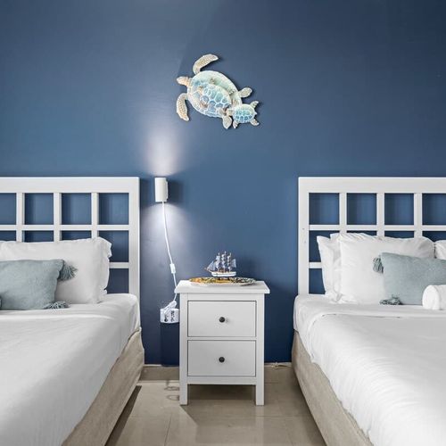 Drift off to sleep in pure comfort with crisp, white linens and plush bedding on both beds, ensuring a restful night after your San Juan adventures.