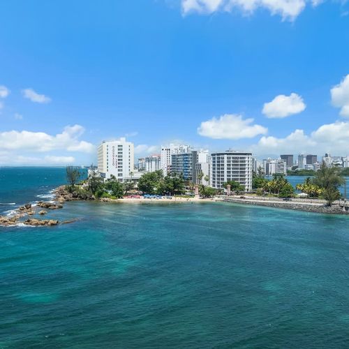 Unforgettable panoramic lagoon and city skyline views from your private balcony, a truly mesmerizing backdrop.