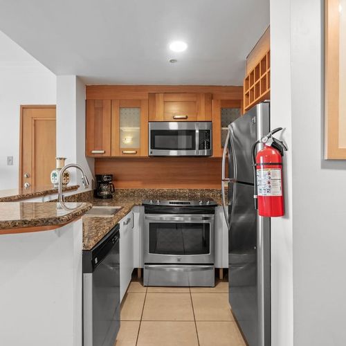 Sleek, fully-equipped kitchen with granite countertops and stainless steel appliances, ready for your culinary adventures
