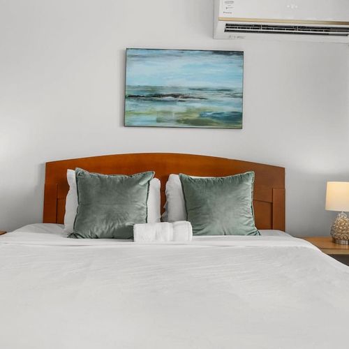 Drift off to sleep in this tranquil bedroom, where the focus is on a cozy and inviting sleeping experience.