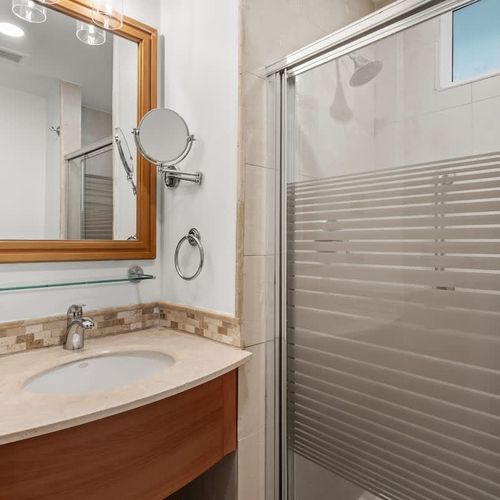 Refreshed and ready! Enjoy a clean and contemporary bathroom with a convenient, accessible shower.