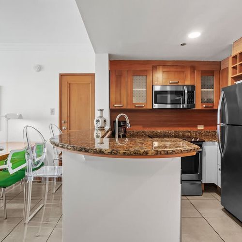 Spacious, fully equipped kitchen with ample counter space, perfect for preparing delicious meals during your stay.