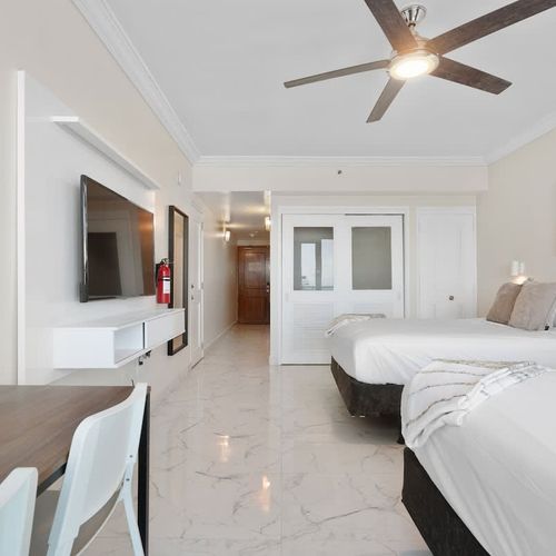 A versatile space. Two double beds and a TV make this a great room for groups.