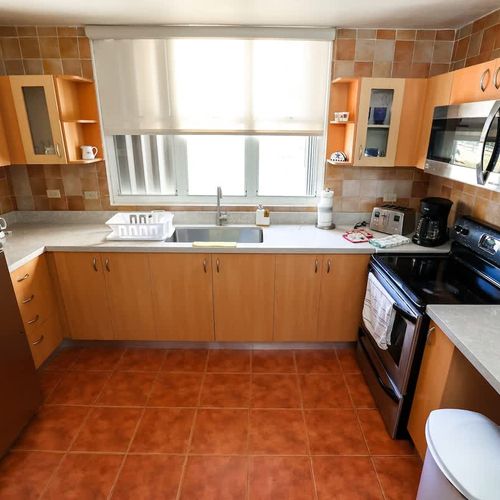 The kitchen is the home's heart, where flavors come alive.