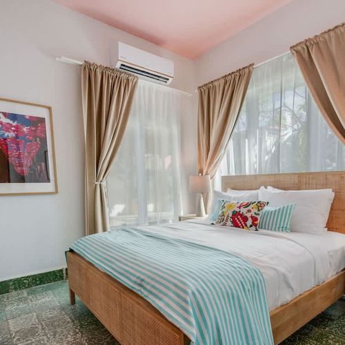 Cozy and tranquil bedroom with a plush queen-size bed, perfect for unwinding after a day of exploring.