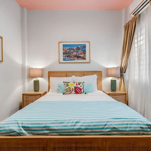 Relaxing retreat with soft pillows, fresh linens, and a peaceful color palette.